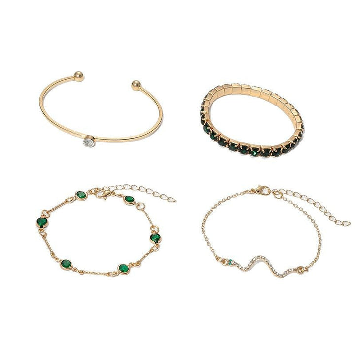 Veda Bremen Golden emerald bracelet set featuring gold-toned bangles with emerald accents, elegant jewelry for women.