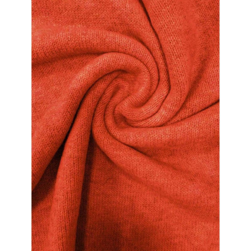 LuroLondon Button-Decorated Sweater, close-up of soft knit fabric with decorative buttons on the front.