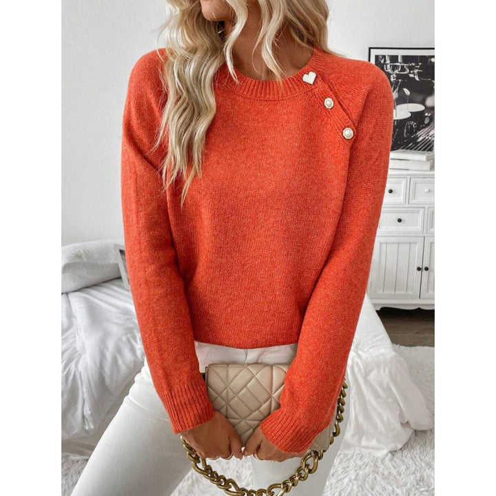 LuroLondon Button-Decorated Sweater featuring a cozy knit design with stylish button embellishments on the front.