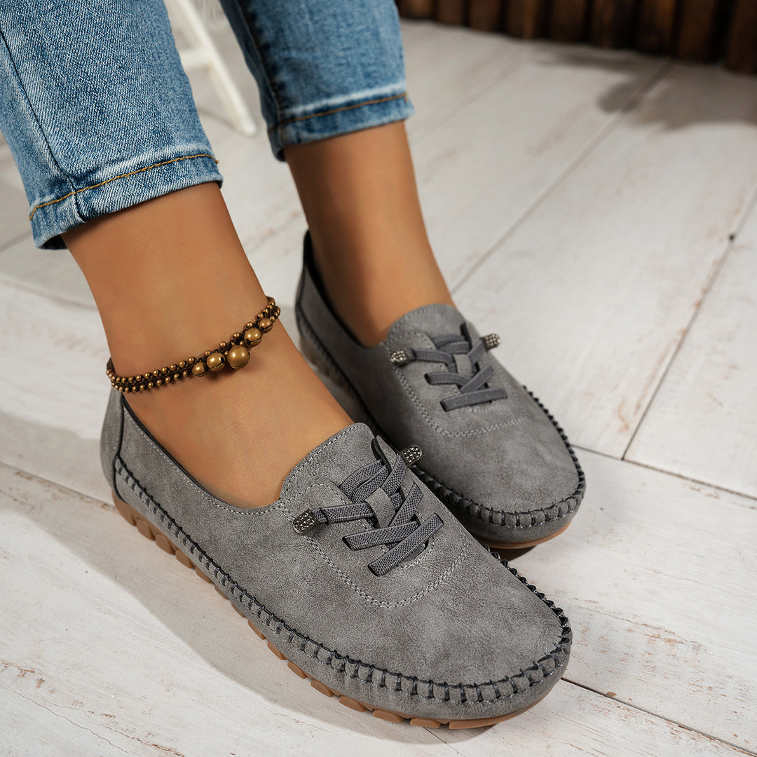 Veda Bremen Valerie slipper for sensitive feet with full support, shown in a cozy indoor setting with soft fabric and supportive sole