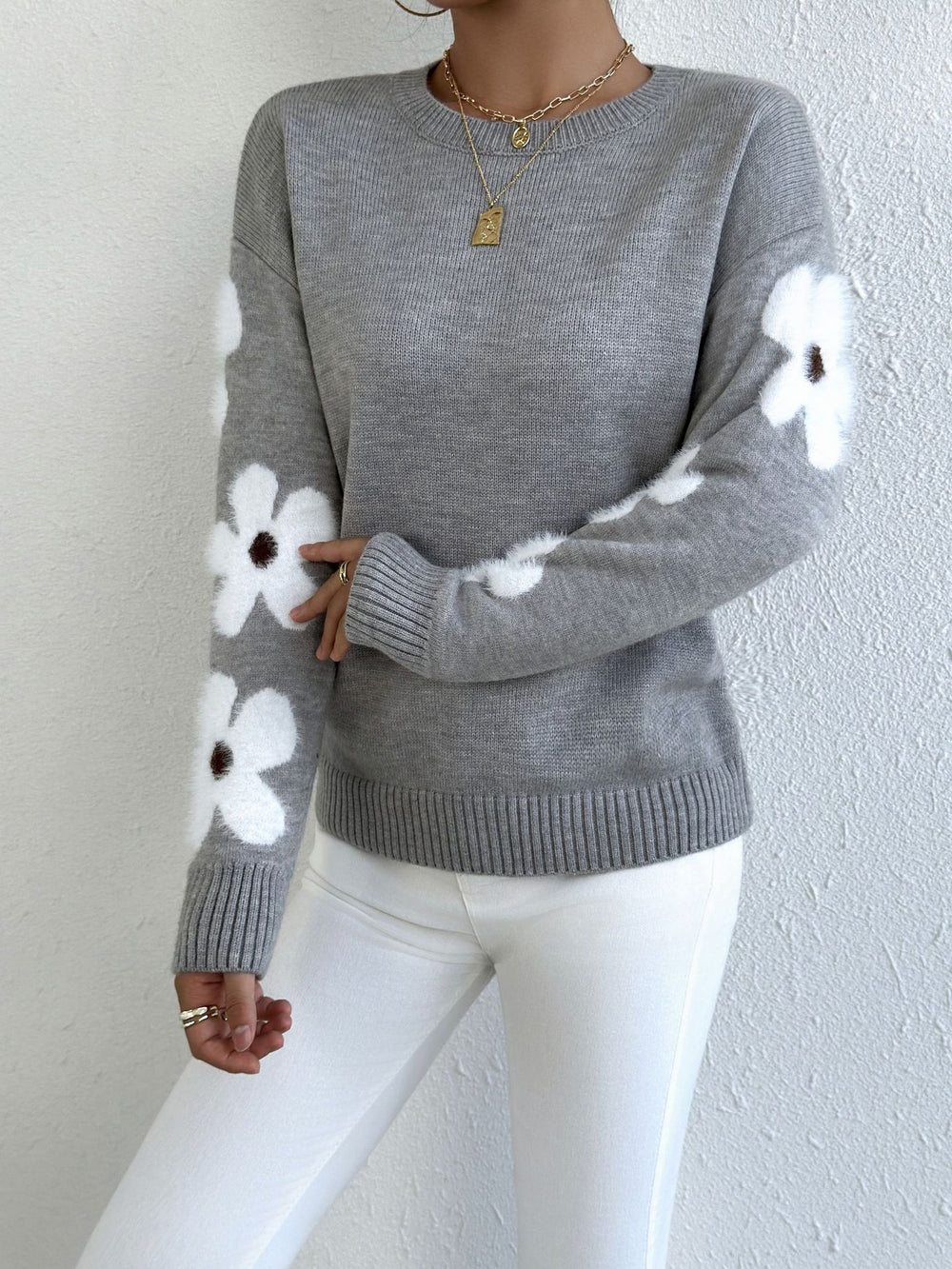 LuroLondon floral round neck sweater with colorful floral patterns on soft fabric, close-up view of the sweater's design.
