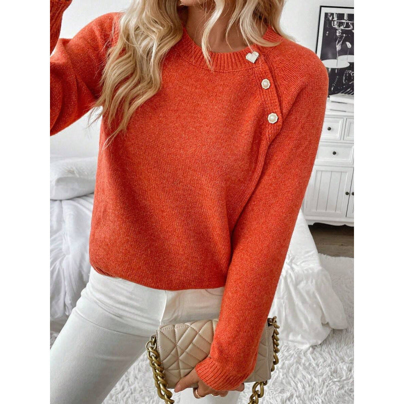 LuroLondon Button-Decorated sweater with colorful buttons and cozy knit fabric, shown in a close-up view.