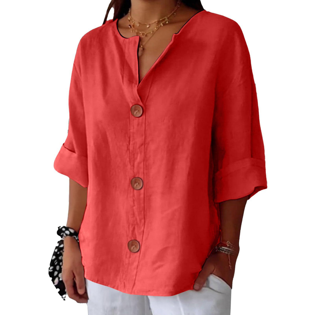 Veda Bremen Leah minimalistische Bluse in neutral fabric, featuring clean lines and a relaxed fit, displayed on a hanger.