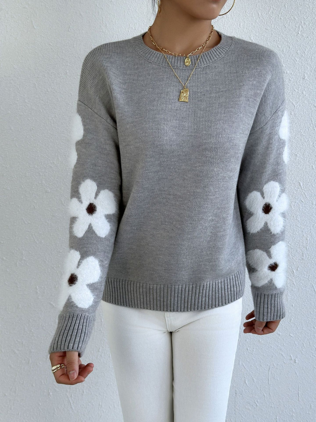 LuroLondon floral round neck sweater with colorful floral pattern and cozy knit fabric, displayed on a white background.