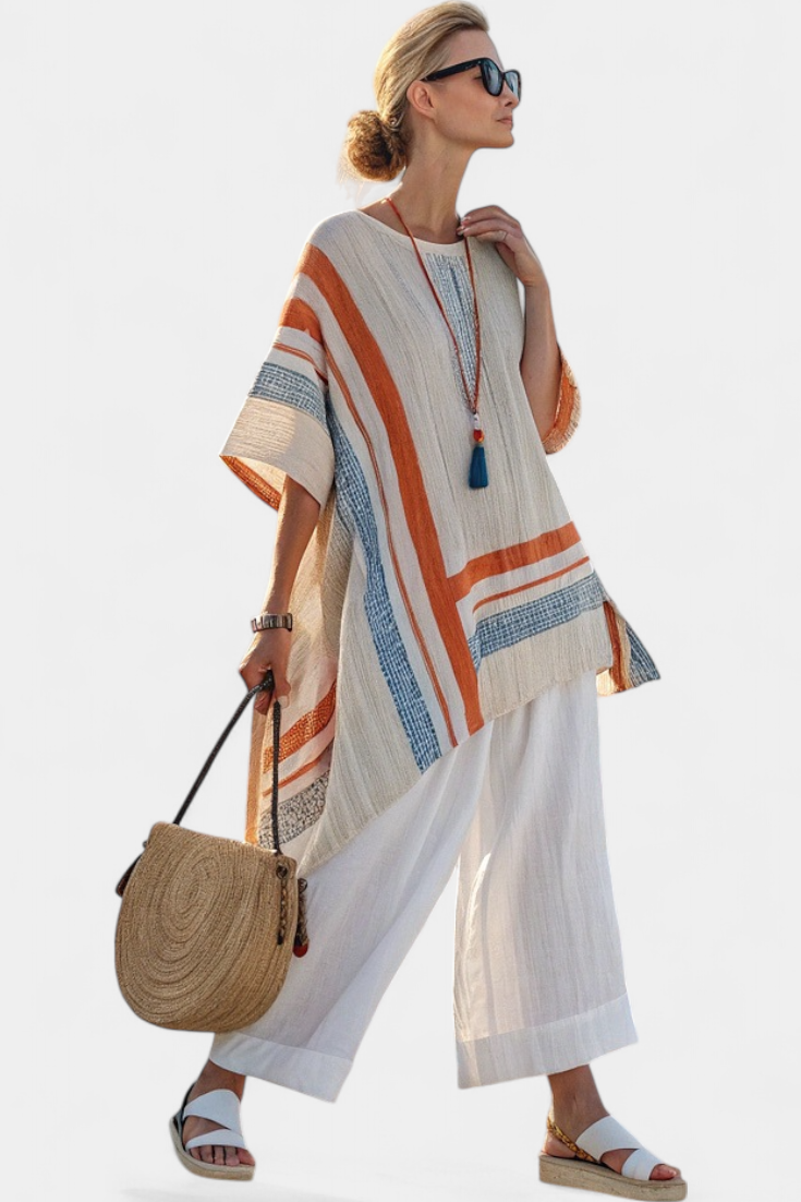 Veda Bremen Caevan set featuring a refined asymmetrical blouse and wide linen pants, styled together in a casual elegant look.