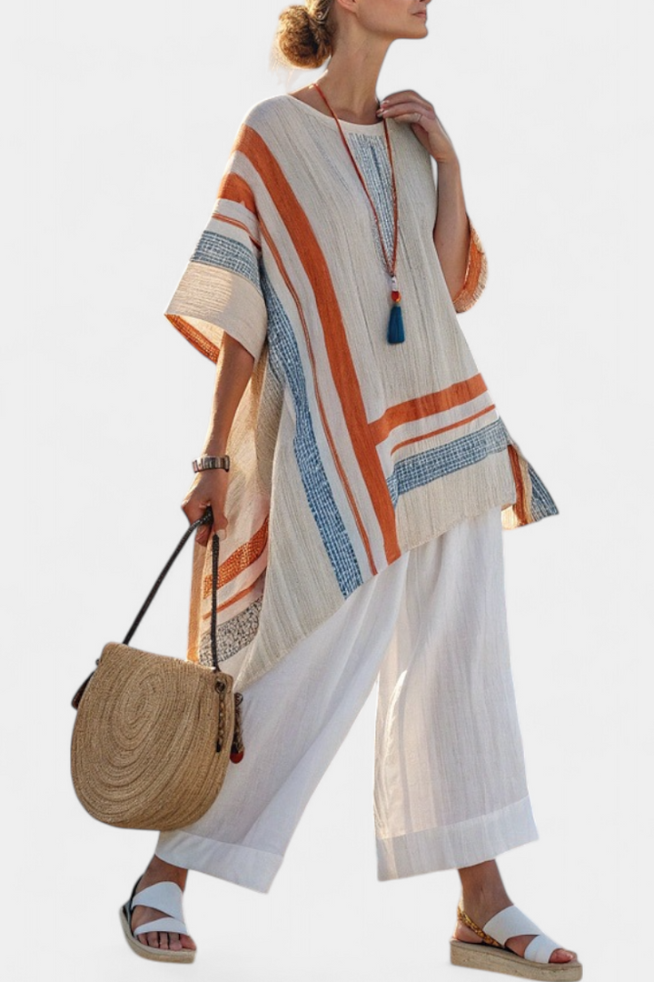 Veda Bremen Caevan set featuring a refined asymmetric blouse and wide linen trousers, styled together for a modern, elegant look.
