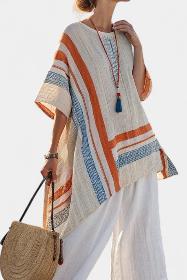 Veda Bremen Caevan set with a refined asymmetric blouse and wide linen pants, styled for a chic, modern look.