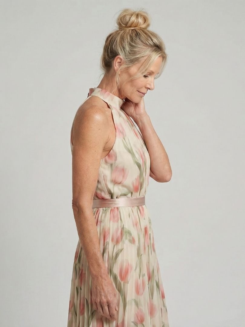 Veda Bremen Aurelle floral midi dress with halter neck, featuring a colorful flower pattern and elegant design.