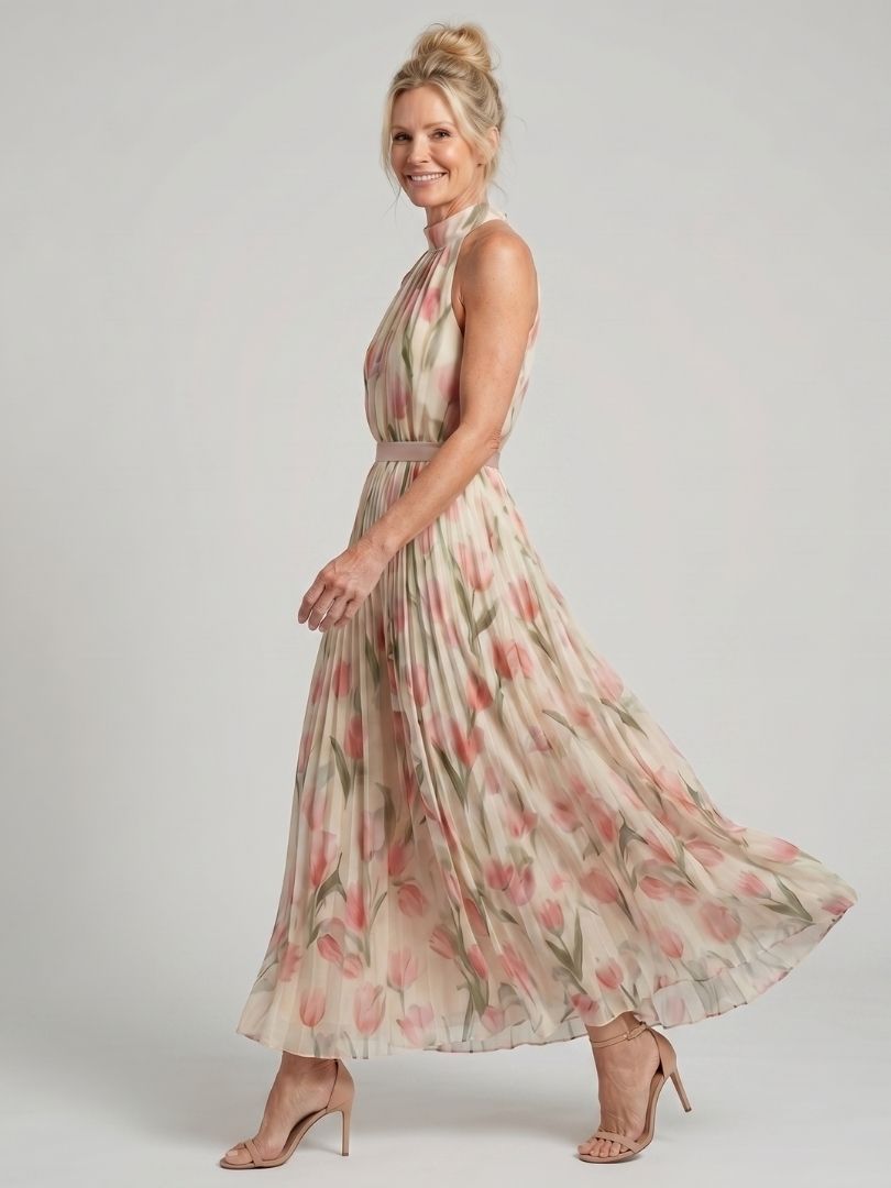 Veda Bremen Aurelle floral midi dress with halter neck and vibrant flower print, displayed on a mannequin.