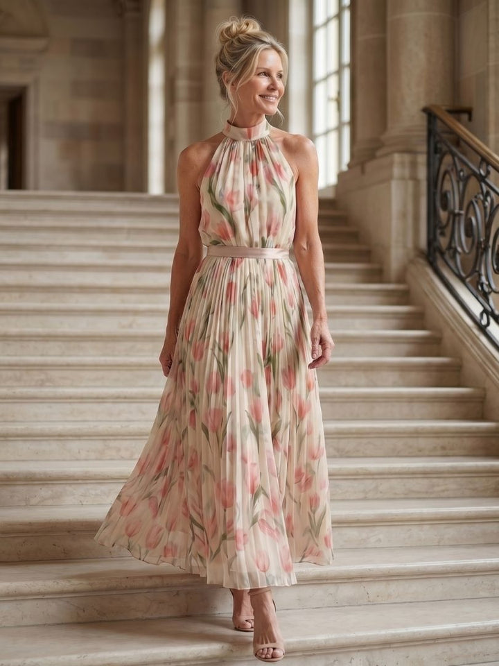 Veda Bremen Aurelle floral midi dress with halter neck and vibrant flower pattern, showcasing a stylish summer look.
