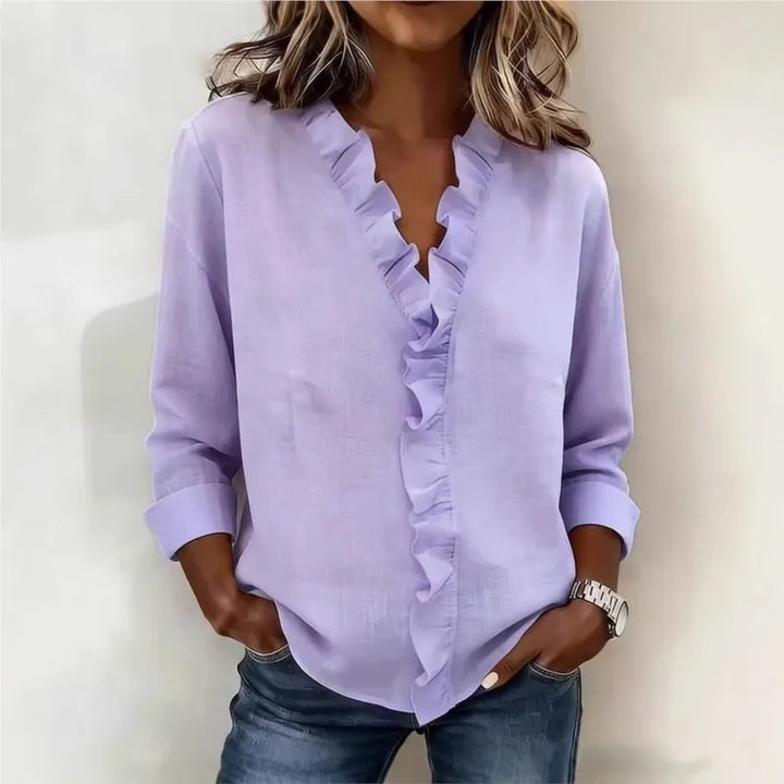 Veda Bremen Sorelle™ blouse with vertical ruffle design, showcasing elegant, timeless style in soft fabric detail.
