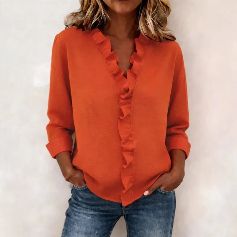 Veda Bremen Sorelle™ blouse with vertical ruffle, showcasing elegant, timeless style and lightweight fabric in soft tones.