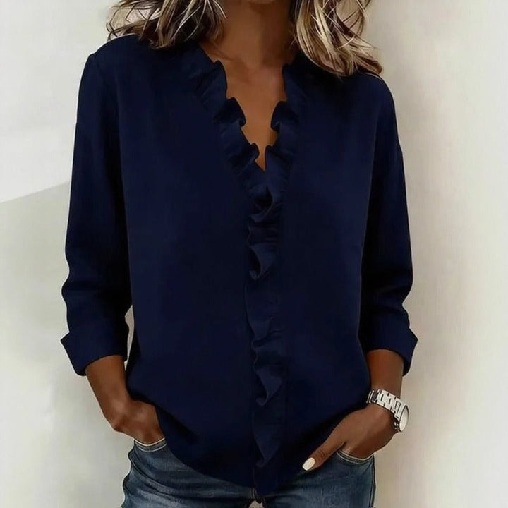 Veda Bremen Sorelle™ blouse with vertical ruffle details, showcasing a classic, elegant style in soft fabric.