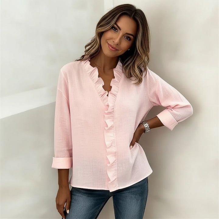 Veda Bremen Sorelle™ blouse with vertical ruffle details, showcasing a timeless, elegant style in a lightweight fabric.