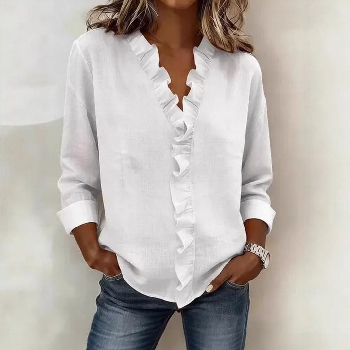 Veda Bremen Sorelle™ blouse with vertical ruffle details, showcasing a timeless, elegant style in soft fabric.