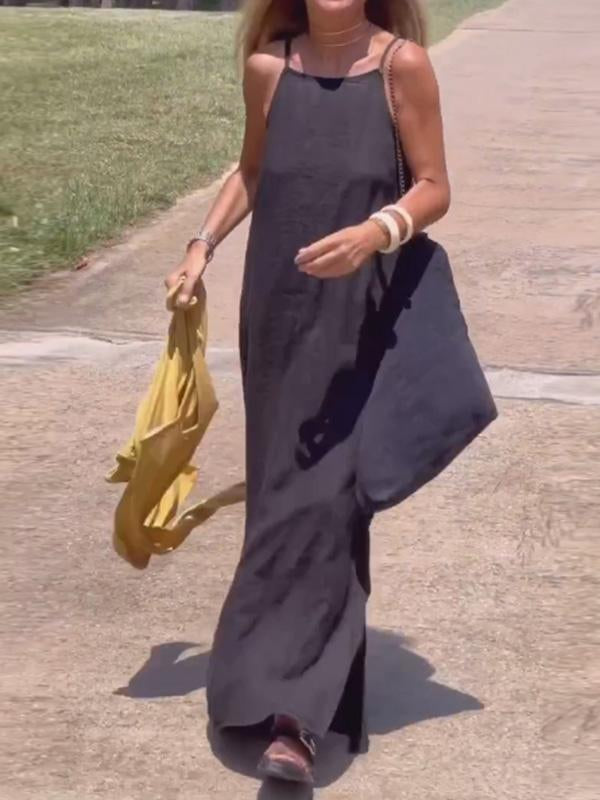 Veda Bremen casual long cotton and linen dress for women, flowing and comfortable, shown in a natural outdoor setting.