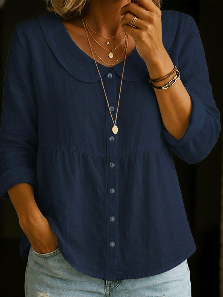 Veda Bremen Arlira linen blouse with Peter Pan collar, soft textured fabric, shown on a hanger.