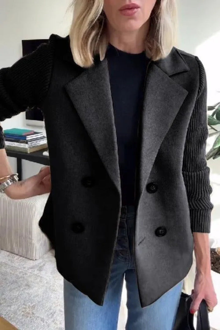 Black Siena blazer by Lurolondon with tailored fit and knitted sleeves, shown on a model.