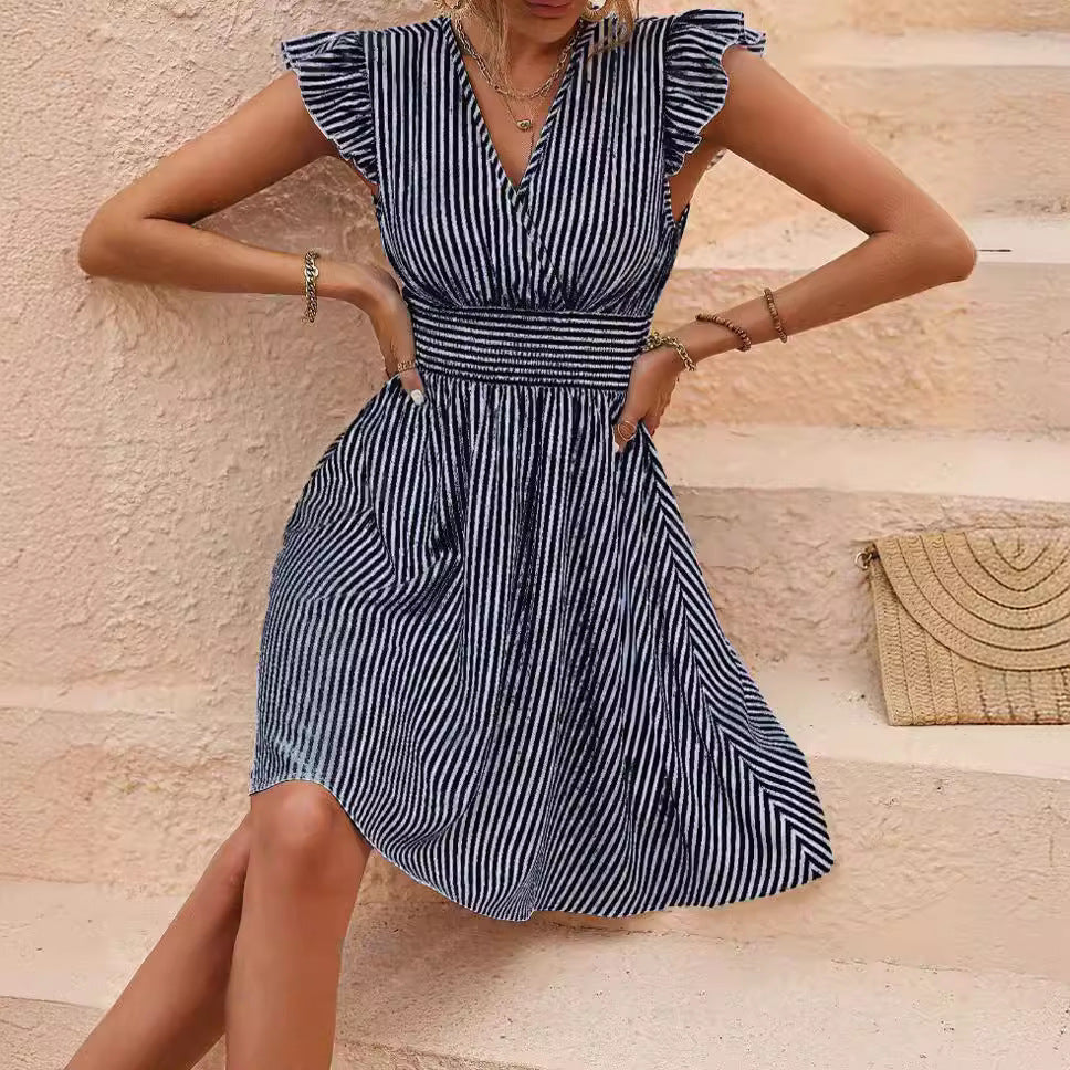 Black striped Veda Bremen ruffled dress with a flowing silhouette and gathered details, perfect for elegant or casual occasions.