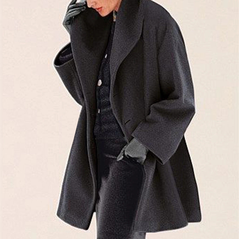 Black The Cocoon Winter Coat by Lurolondon.co.uk, stylish insulated coat with a hood and quilted design for cold weather.