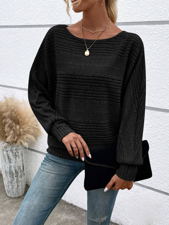 Black Rippstrick-Loser crewneck sweater by Veda Bremen, showcasing a close-up of the textured knit fabric and relaxed fit.