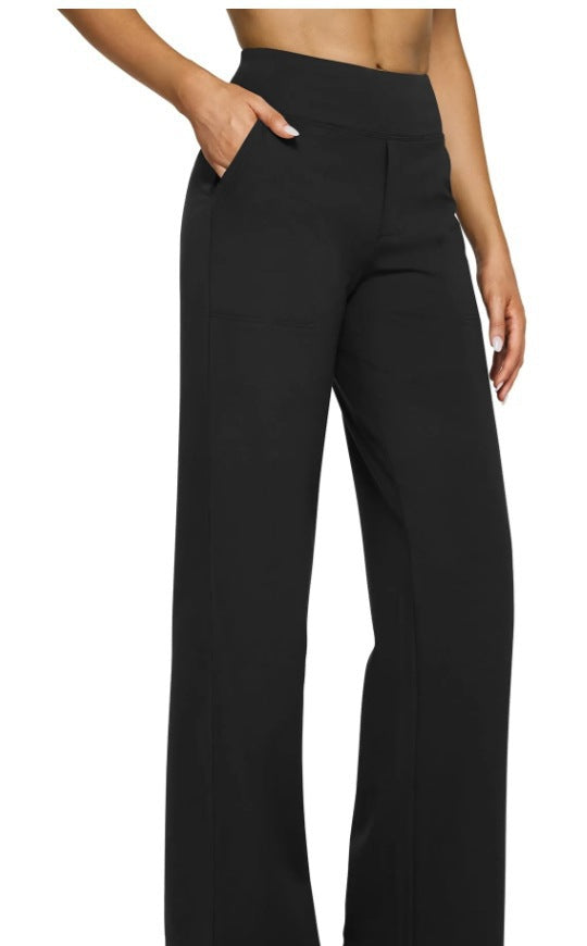 Black Klara Stretch Trousers by Lurolondon.co.uk, featuring a fitted waist, slim legs, and smooth fabric for a sleek, modern look.