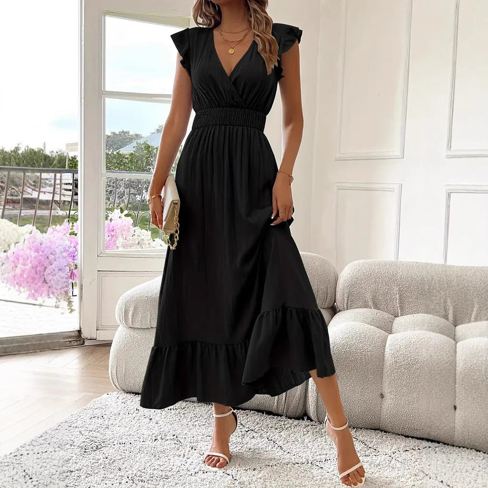 LuroLondon Brittany Breeze Dress in black, featuring a flowing design with short sleeves and a relaxed fit.