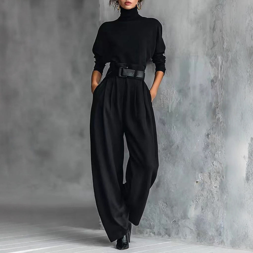 Black Aria long sleeve jumpsuit by Lurolondon featuring a fitted silhouette and elegant design.