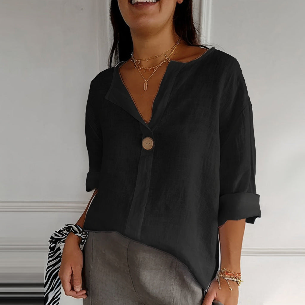 Black Valentina blouse by Veda Bremen, featuring a stylish, loose-fitting design with long sleeves and elegant fabric details.