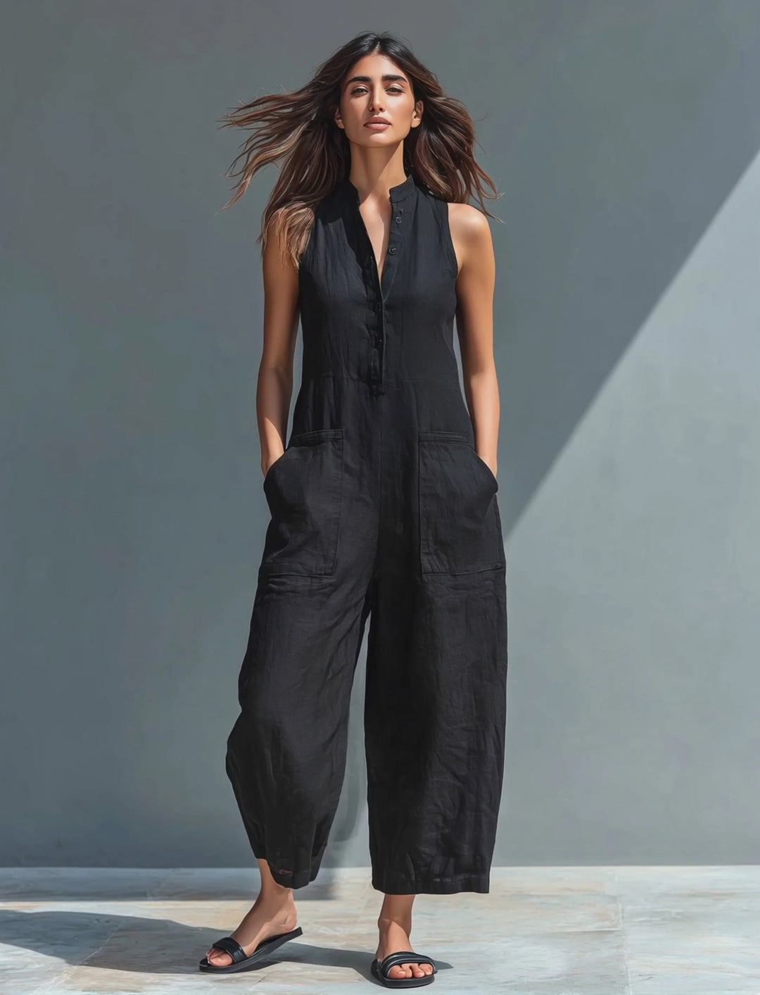 Black Veda Bremen Lotte sleeveless minimalist jumpsuit with a sleek, modern design, perfect for contemporary fashion.