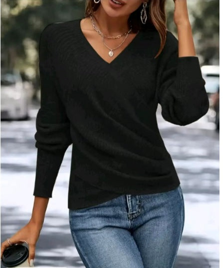 Black Vee-Neck Wrap Top from Lurolondon.co.uk, showcasing a stylish, fitted women&