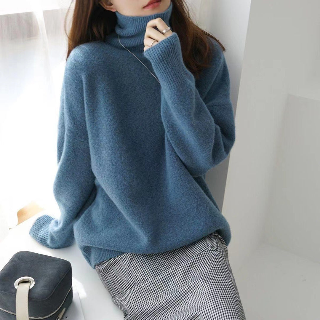 LuroLondon Marilou Cashmere Turtleneck sweater in blue, featuring a cozy, fitted design and ribbed collar.