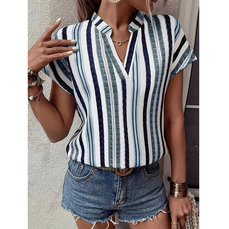 Blue striped Veda Bremen tunic with V-neck, featuring a relaxed fit and lightweight fabric, ideal for casual wear.