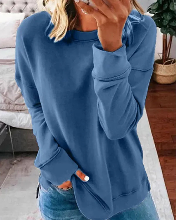 Blue classic solid cotton T-shirt from Lurolondon.co.uk displayed on a hanger, showcasing its simple, comfortable design.