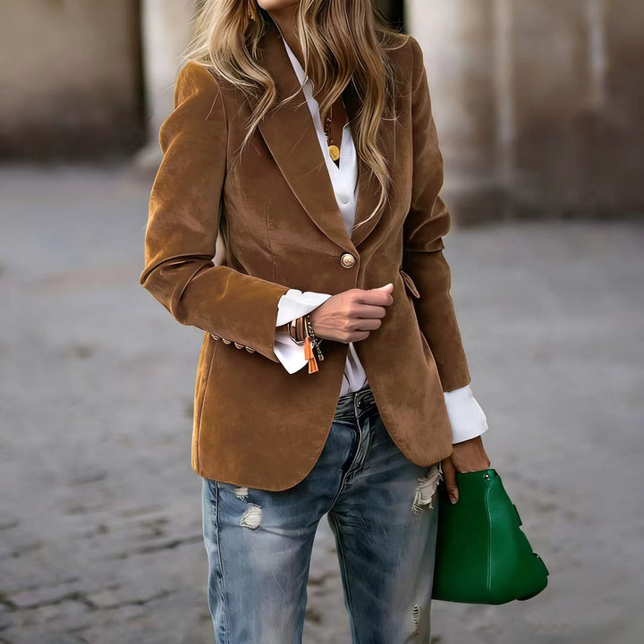 Veda Bremen Alisha tailored brown blazer on a hanger, close-up view of fitted blazer with lapels and structured design.