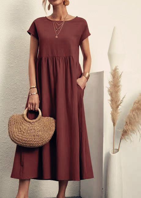 Veda Bremen Gabrielle midikleid in burgundy with flowing silhouette and elegant design, showcased on a model.