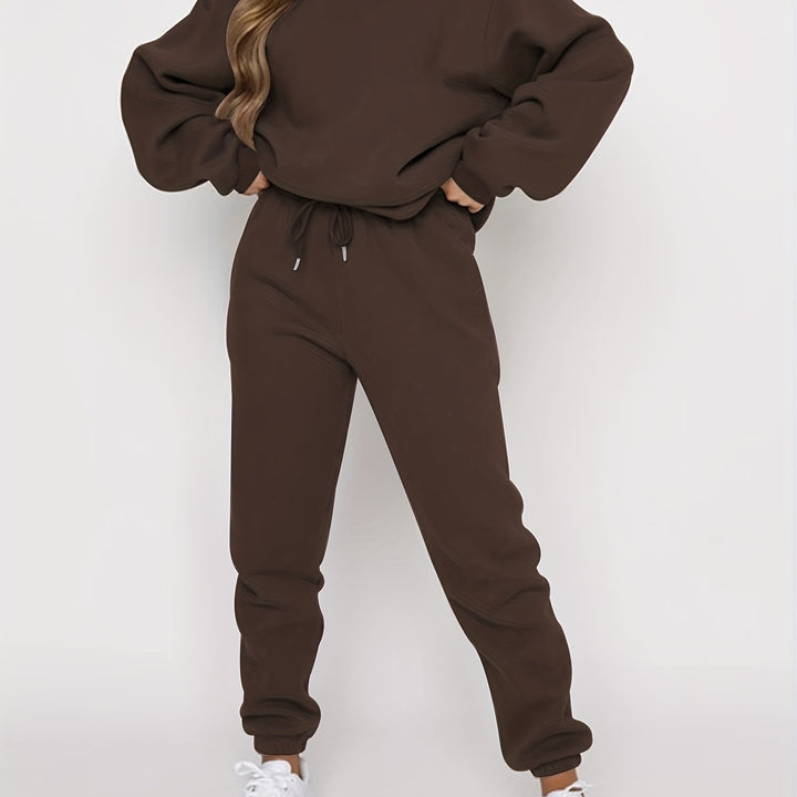 LuroLondon The Simple Two-Piece set featuring a minimalist top and matching pants in neutral fabric.