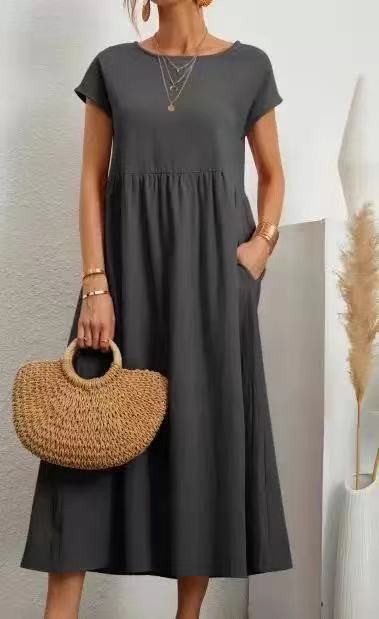 Dark grey Veda Bremen Gabrielle midikleid with flowing silhouette, showcasing elegant fabric and relaxed fit on a model.