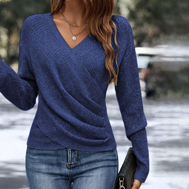 Dark blue Vee-Neck Wrap Top by Lurolondon displayed on a model, showcasing a stylish and fitted design.