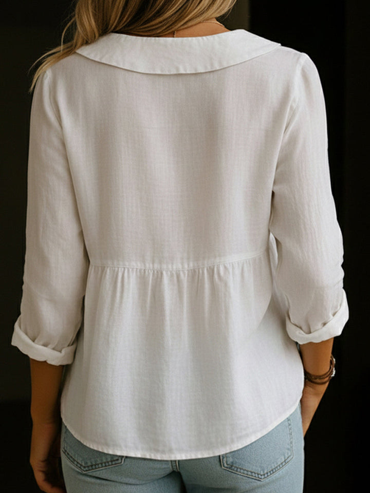 Veda Bremen Arlira linen blouse with Peter Pan collar, soft textured fabric, displayed on a neutral background.
