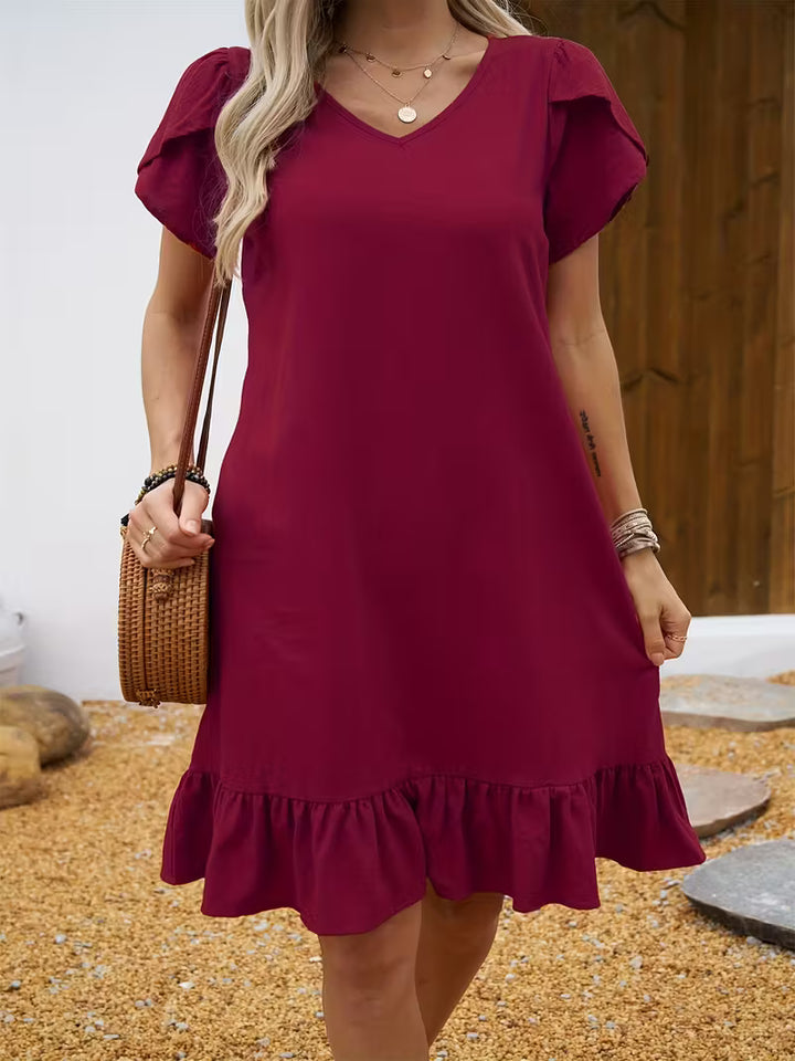 Deep red Veda Bremen V-neck dress featuring a stylish V-neckline and elegant fit, perfect for versatile occasions.