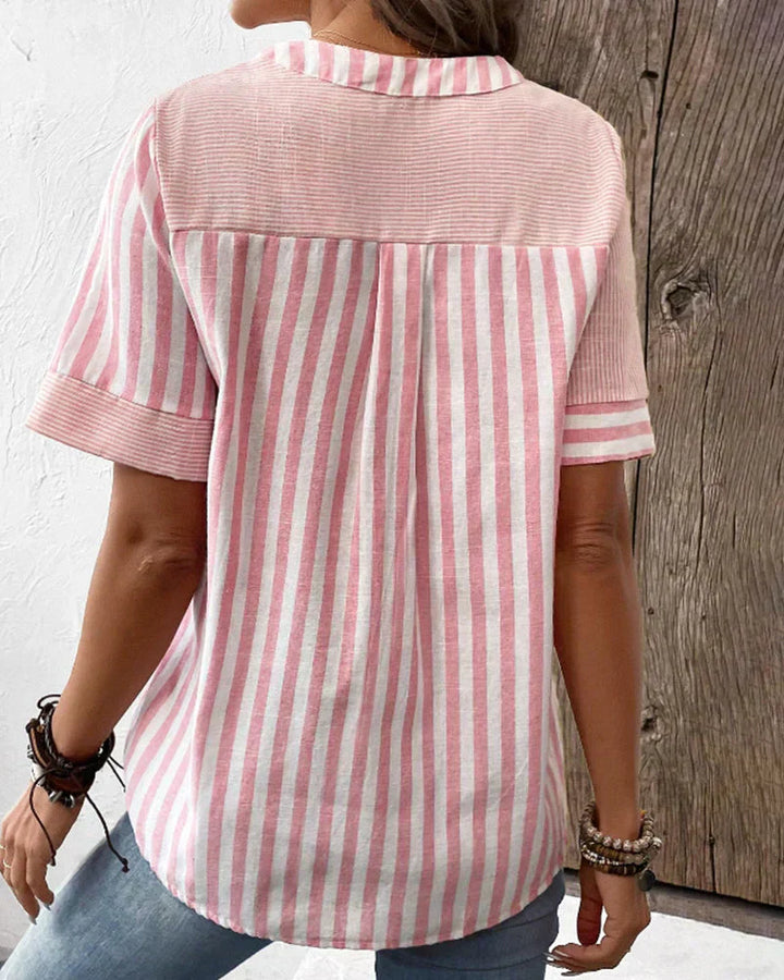 Veda Bremen Talia elegant striped blouse with long sleeves and classic collar, stylishly displayed on a hanger.