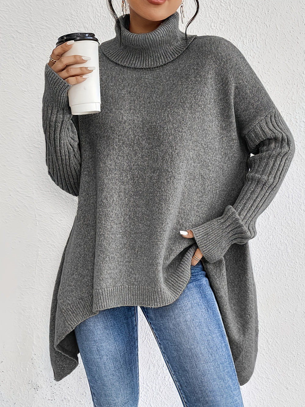 Lindemann Mode Charley casual turtleneck sweater in cozy knit fabric, shown hanging in a factory setting.