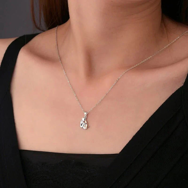 Veda Bremen dog pendant necklace with matching earrings, featuring a faithful dog design, on a simple chain.