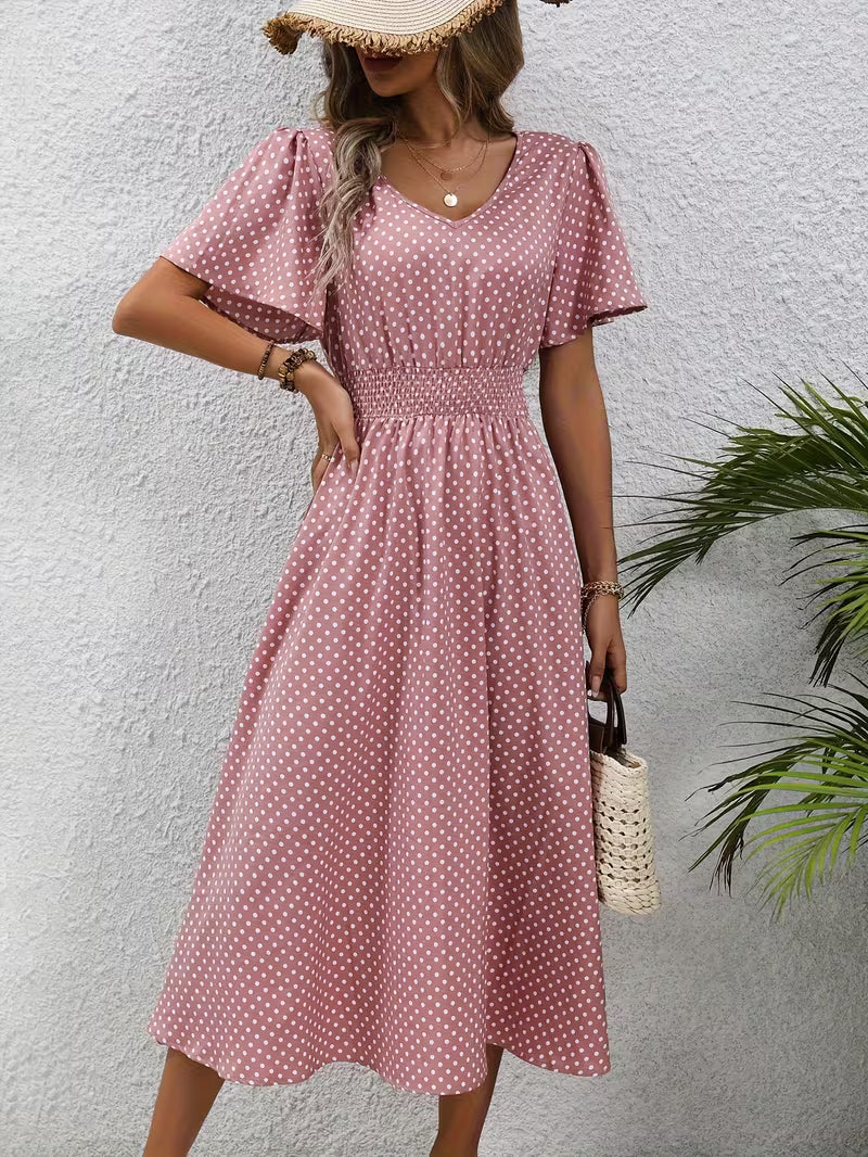 Veda Bremen polka dot dress featuring a front view, showcasing its stylish design and vibrant pattern.