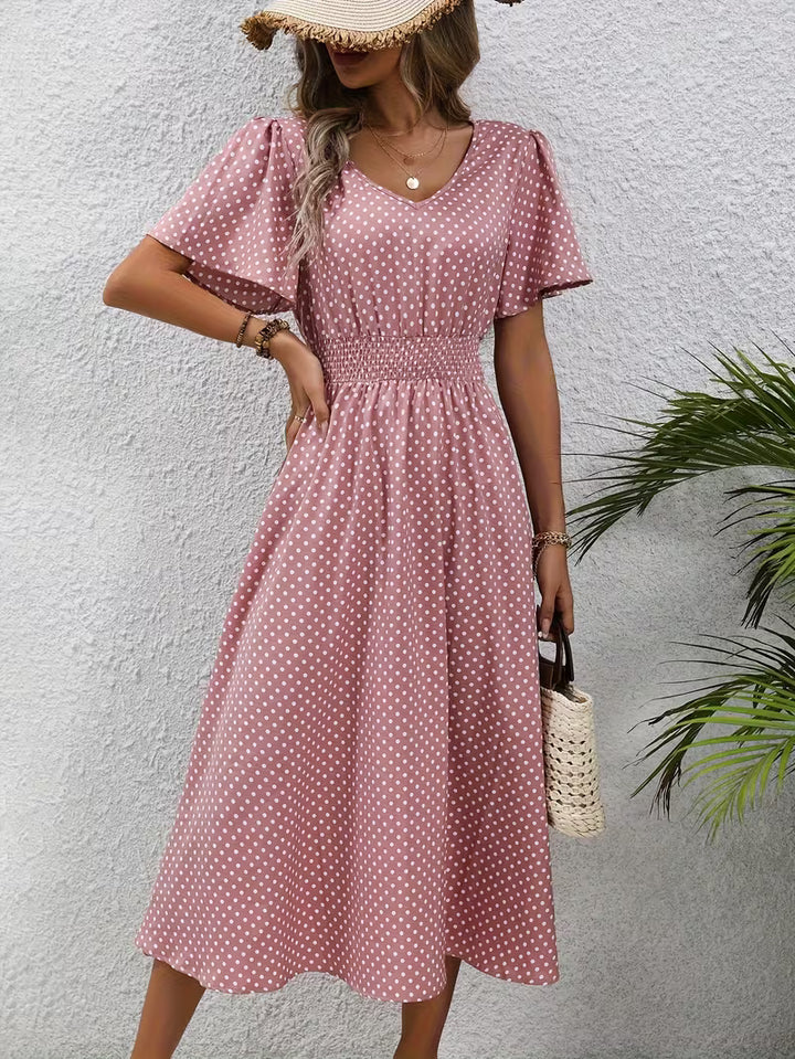 Veda Bremen polka dot dress featuring a front view, showcasing its stylish design and vibrant pattern.