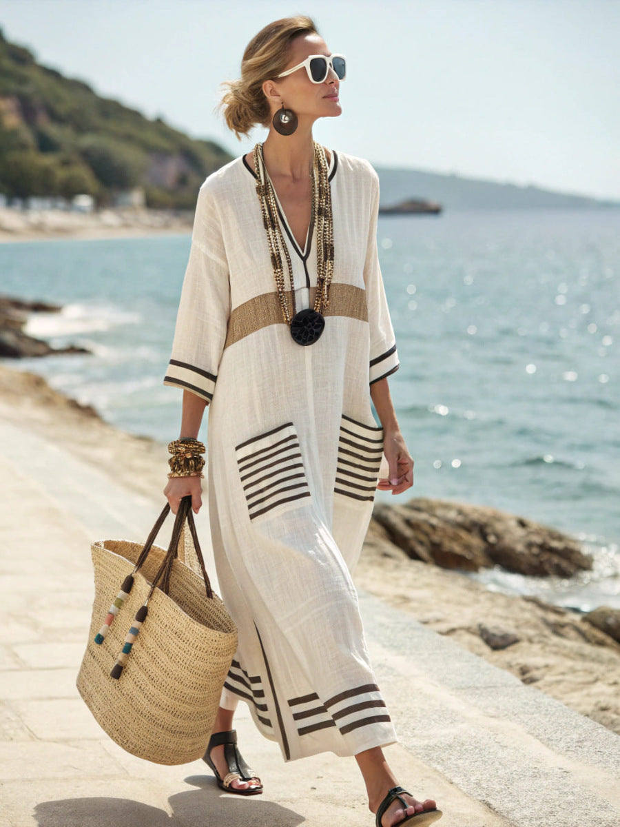 Gold and black Sally kaftan dress by Veda Bremen featuring flowing fabric and elegant design, perfect for stylish summer wear.