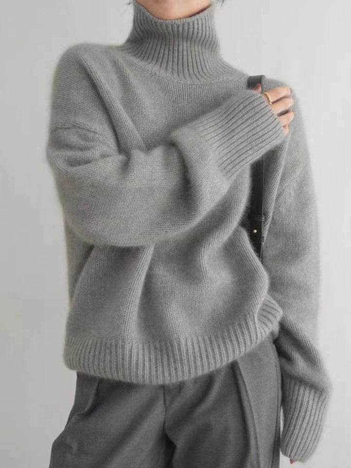 LuroLondon Marilou Cashmere Turtleneck in grey, featuring a cozy, soft knit design perfect for fall and winter wear.