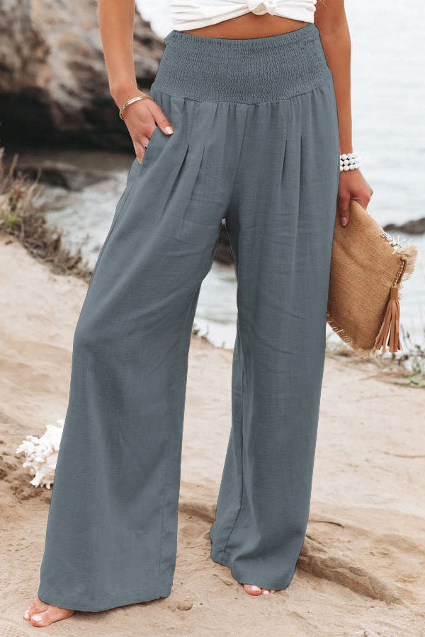 Grey Veda Bremen Romy high-waisted trousers with a tailored fit and wide-leg design, styled on a model.