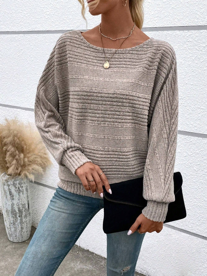 Grey Rippstrick-Loser crewneck sweater by Veda Bremen, featuring a soft, textured knit fabric and a relaxed fit.